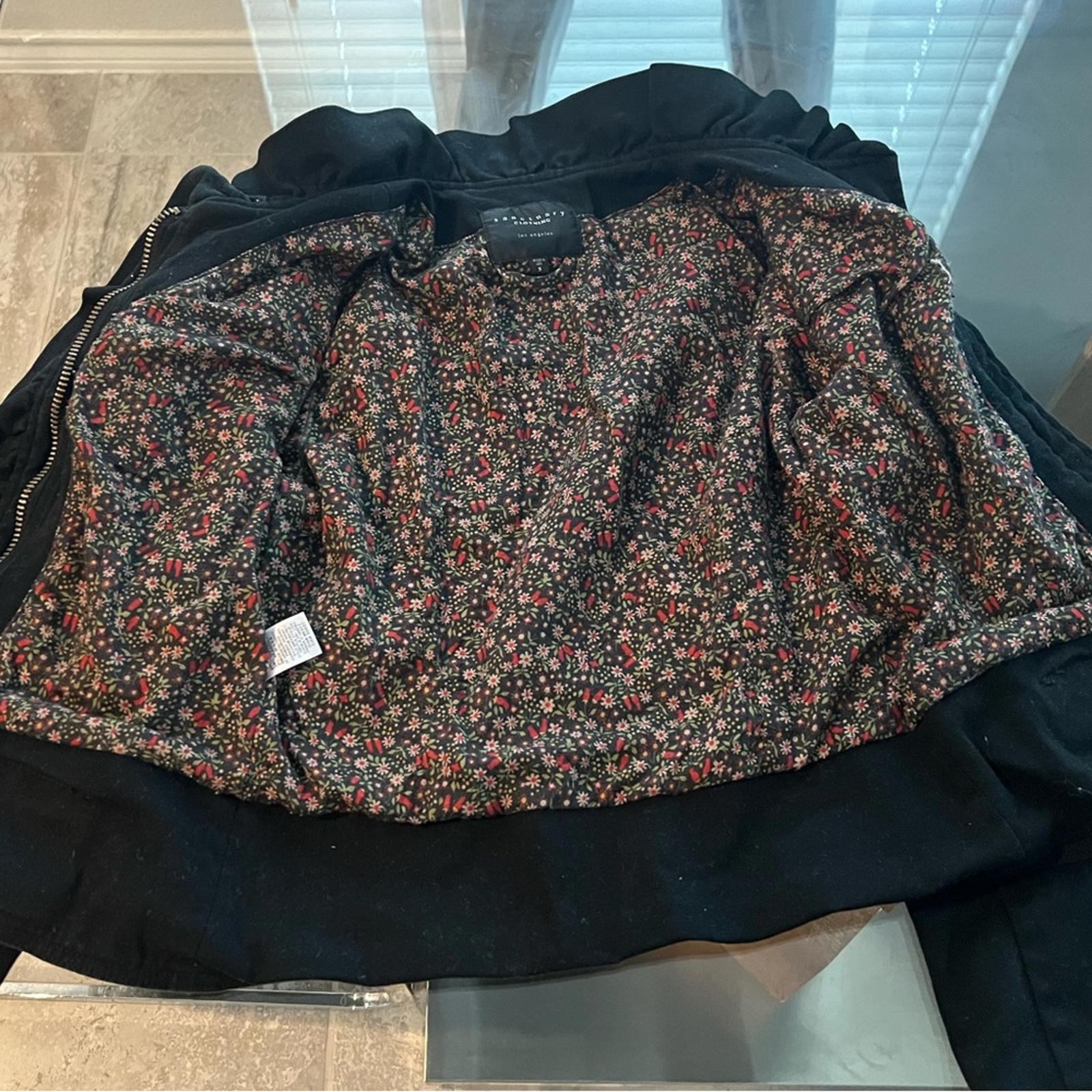 Anthropologie’s Sanctuary Ruffle Collar Denim Moto Jacket, Black Size S