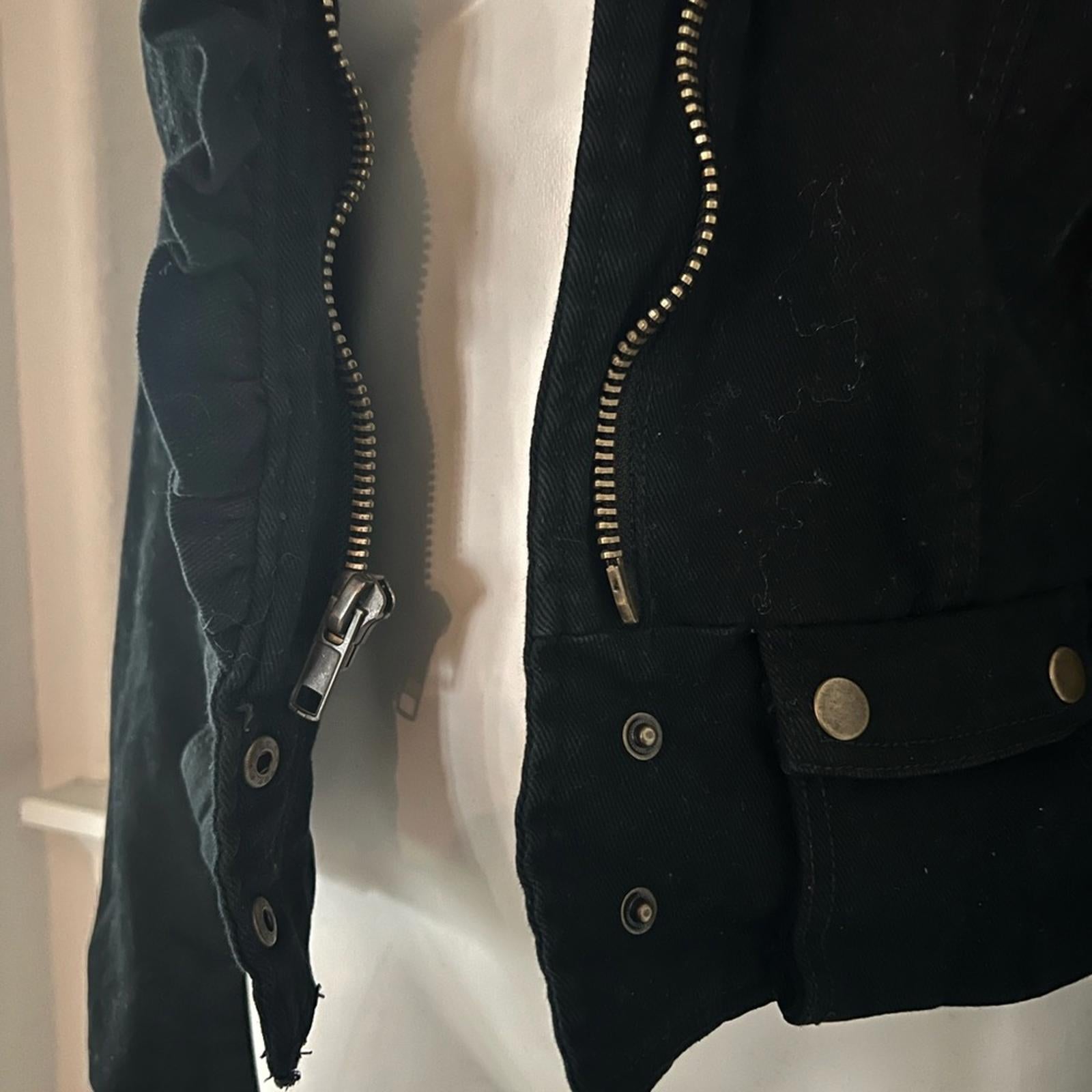 Anthropologie’s Sanctuary Ruffle Collar Denim Moto Jacket, Black Size S